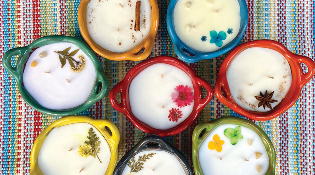 Group of 9 mini candles made in pottery clay vessels. 