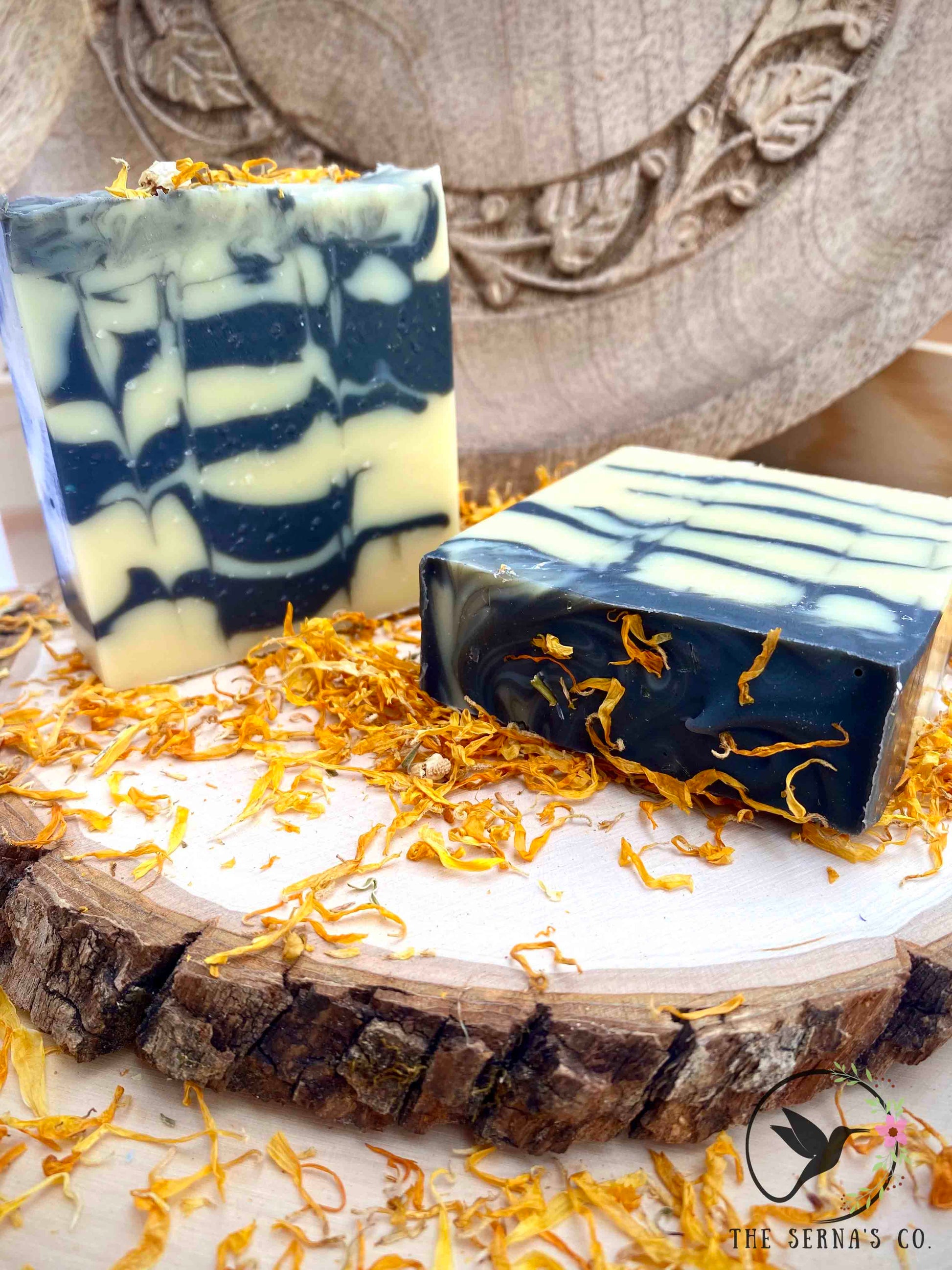 Soap bars displayed on wood with ingredients 